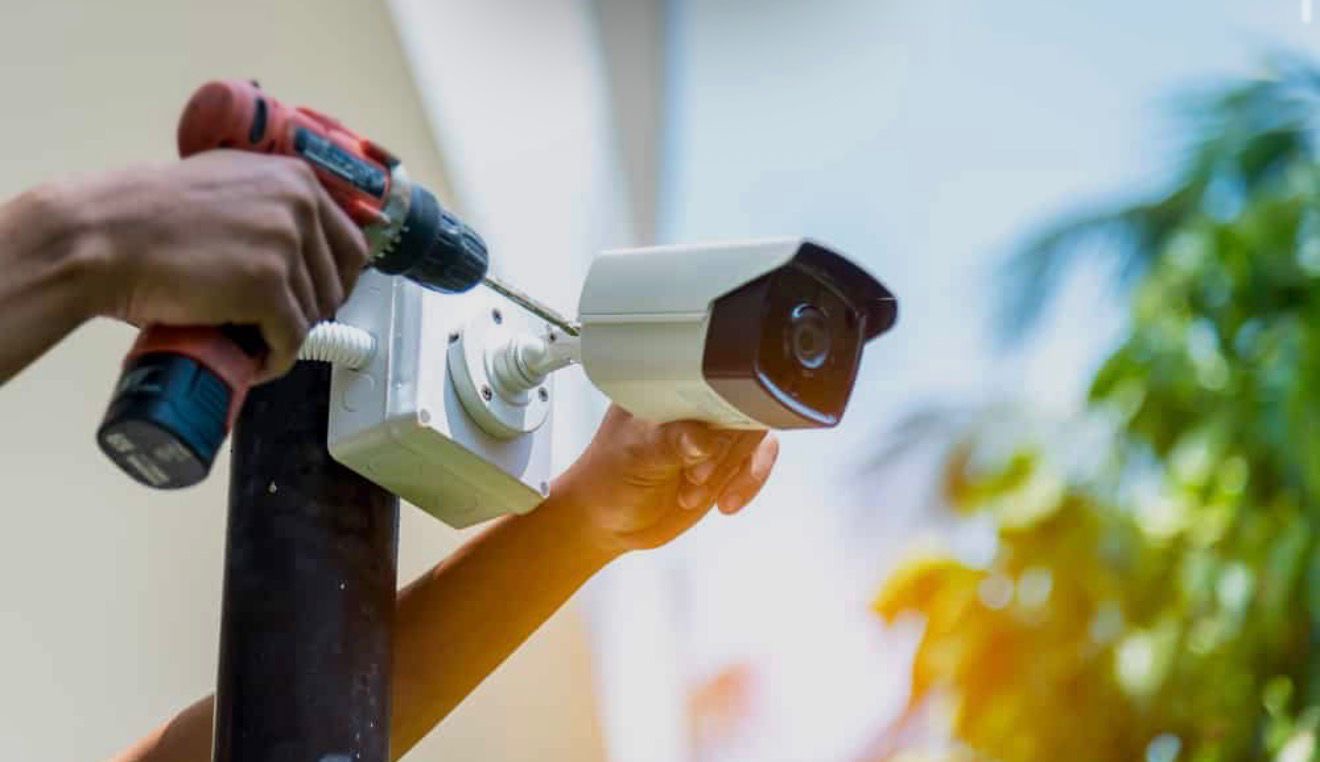 Atlas engineer installing an outdoor CCTV camera